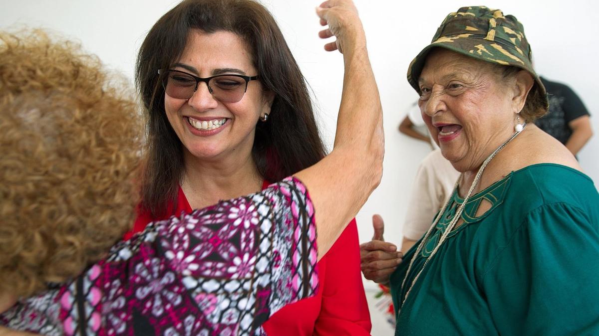 Miami-Dade Commission candidate Zoraida Barreiro shares a laugh with supporters at Unidad Miami Beach on Collins Avenue on Wednesday, May 9, 2018.