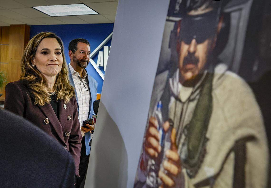United States Repsresentative Maria Elvira Salazar looks at a photograph of a captured Venezuelan leader Nicolás Maduro on display during a pres. conference in Doral, Florida on Saturday, January 3, 2026. 