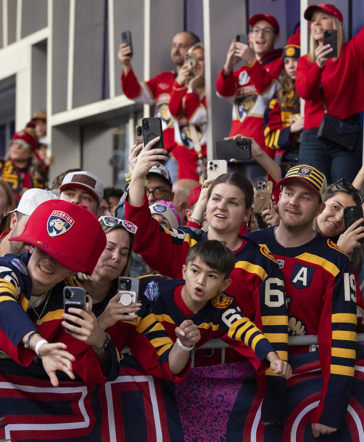 Florida Panthers fans react as players arrive to loanDepot for their Winter Classic outdoor hockey game against the New York Rangers on Friday, Jan. 2, 2026, in Miami, Fla.