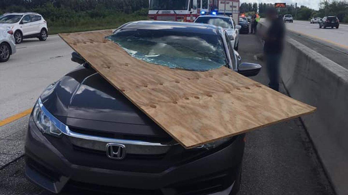 A piece of plywood flew from a pickup truck and sliced through the windshield of a car on Interstate 95 near Rockledge in Brevard County Oct. 12, 2018.