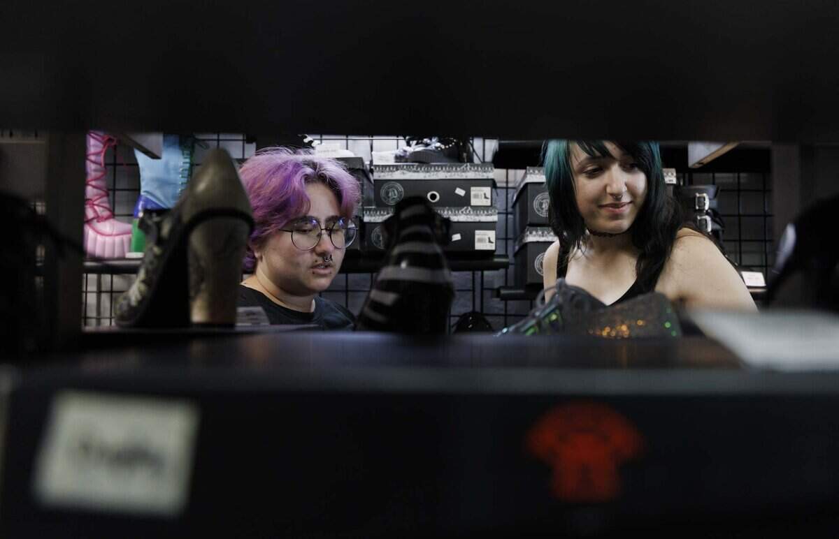 Jayden Hernandez, left, and Melanie Dediego shop at Freak House, an alternative clothing store, on Thursday, June 18, 2026, on S Dixie Hwy in Miami, Fla. Freak House, owned and operated by James and Ana Jones, is closing its doors next Friday. “There's no shops like this here in Miami, Tampa is the closest one,” said Hernandez.