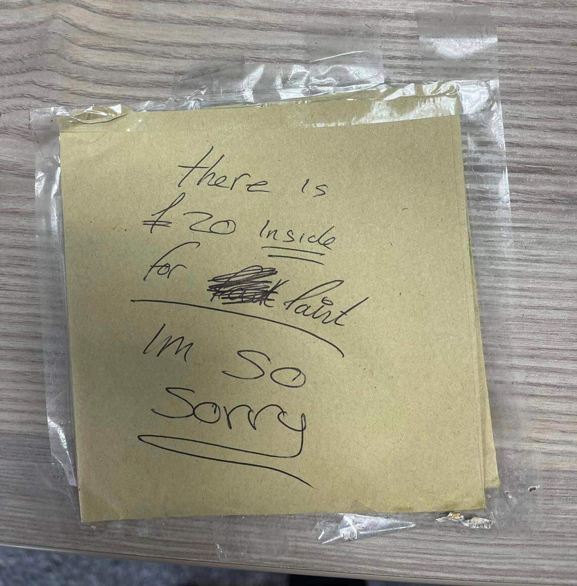 The note left on top of the returned post box.