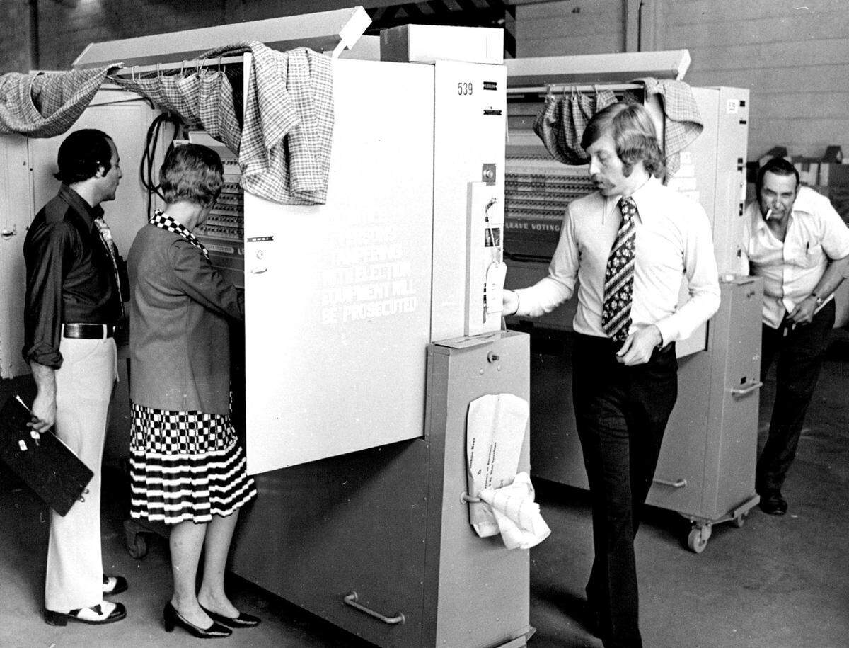 Miami-Dade election officials ready voting machines in 1974.