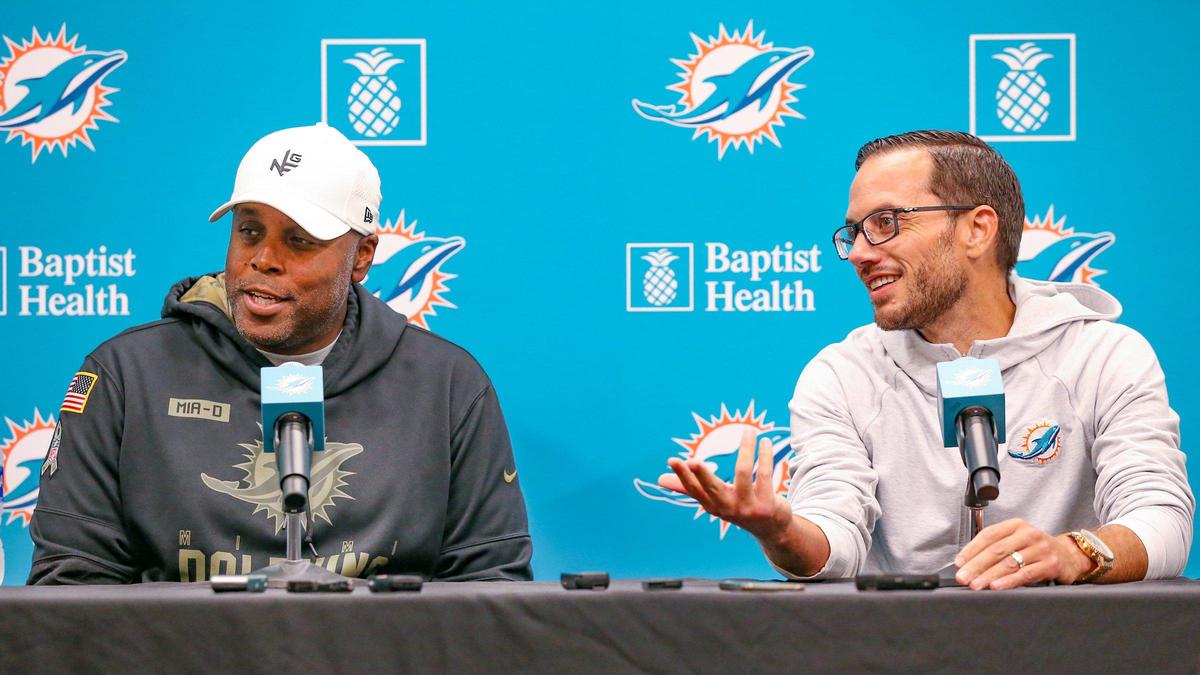 Chris Grier, general manager of the Miami Dolphins, at left, and head coach Mike McDaniel, speak to reporters after practice at Baptist Health Training Complex in Miami Gardens on Tuesday, August 30, 2022.