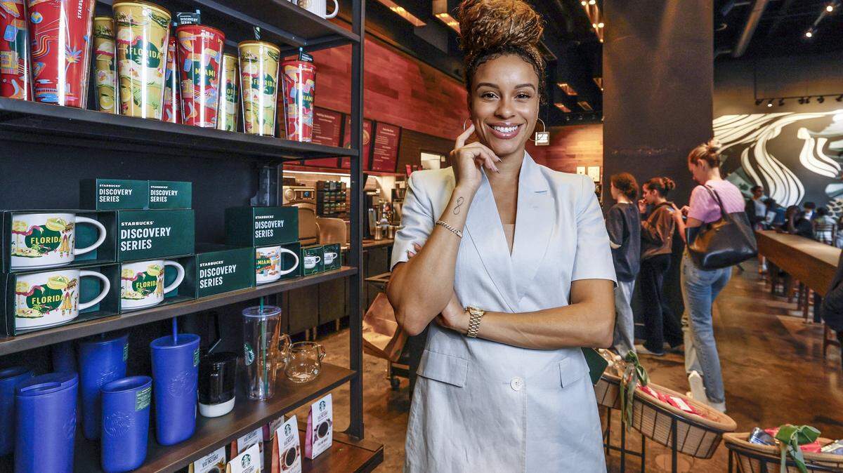 Kylie Russell, CEO and Owner of Priceless One Management, stands inside Starbucks near the Brightline Station in Miami, Florida, on Tuesday, December 9, 2025. Russell family members own a franchise of the coffeehouse chain in downtown Miami.