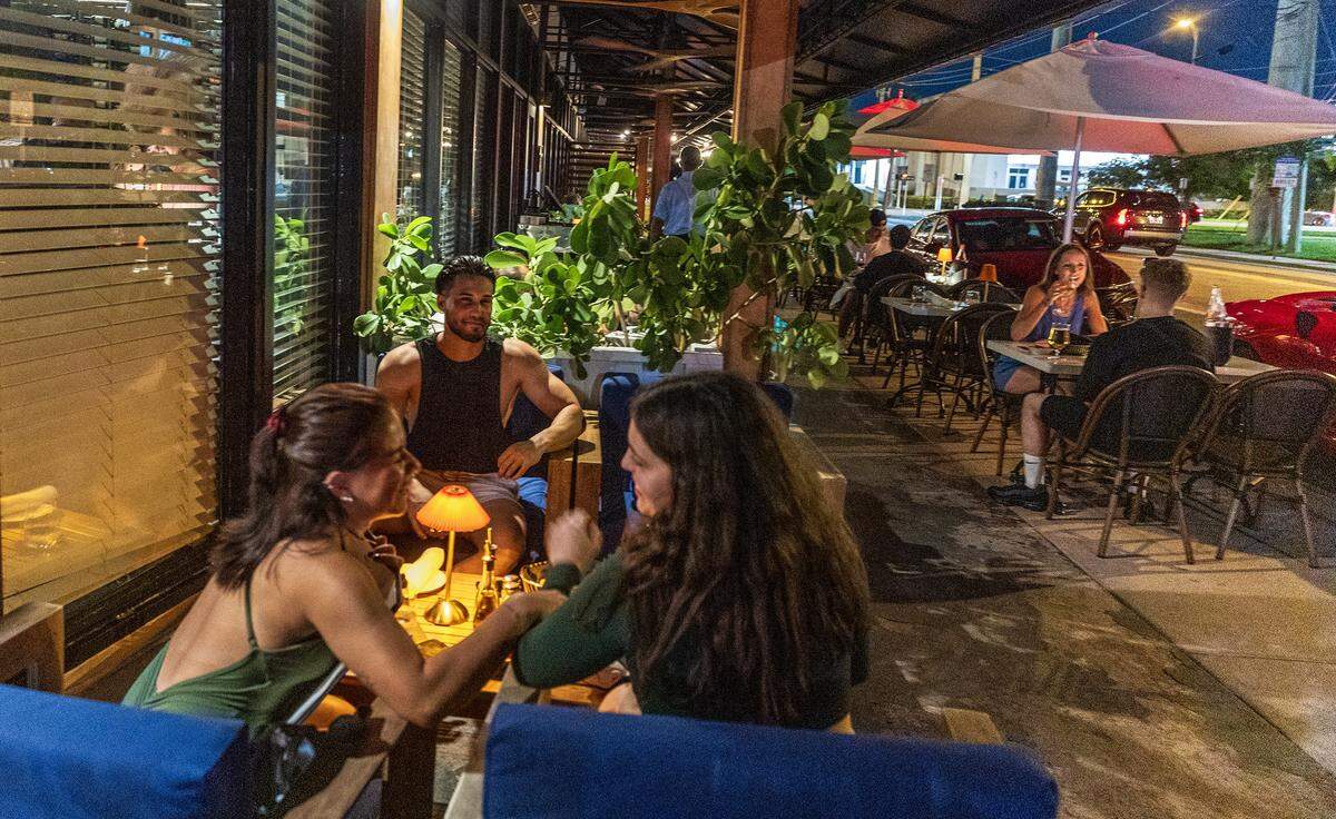 Patrons enjoy eating in the outside area at George's, Italian restaurant celebrating 25 years in North Beach, on Wednesday, August 20, 2025.
