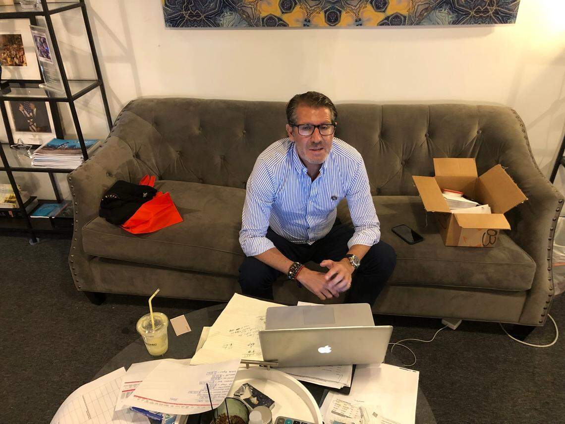 Michael Capponi, in the Doral headquarters of Global Empowerment Mission, a relief organization he founded, looks at a spreadsheet of Champlain Towers residents who survived the partial collapse but lost their homes. His group is providing cash and assistance to the tower’s displaced residents in Surfside.