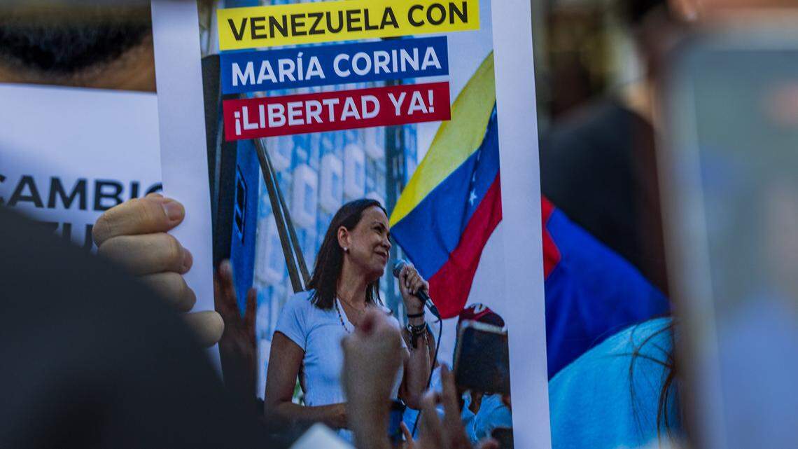 View of a poster supporting opposition leaders María Corina Machado and Edmundo González, displayed by the Venezuelan community that attended a celebration rally outside of El Arepazo in Doral, Florida, a day after the United States attacked Venezuela and captured leader Nicolás Maduro and his wife Cilia Flores, on January 04, 2026.