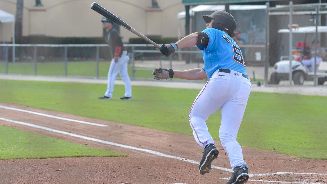 Miami Marlins outfielder prospect Noah Williamson follows through on a home run swing during a simulated game on Saturday, Feb. 12, 2022, at the Roger Dean Chevrolet Stadium complex in Jupiter, Florida.