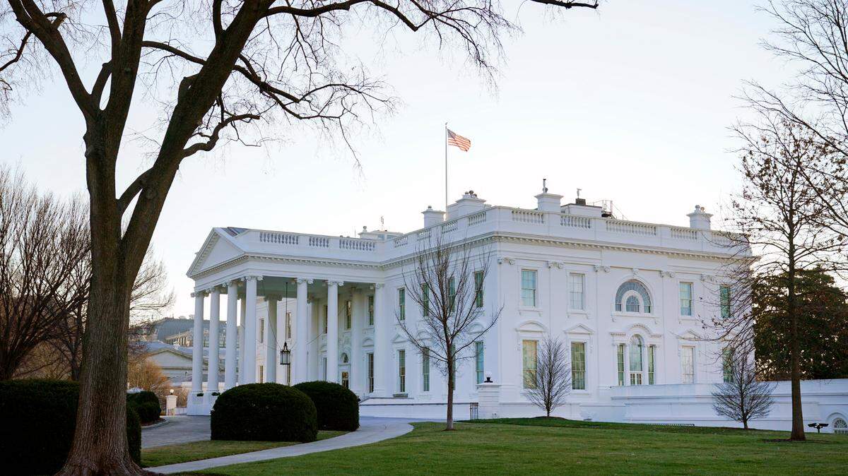 In this photo, an American flag flies over the White House in Washington, Thursday, Jan. 7, 2021.