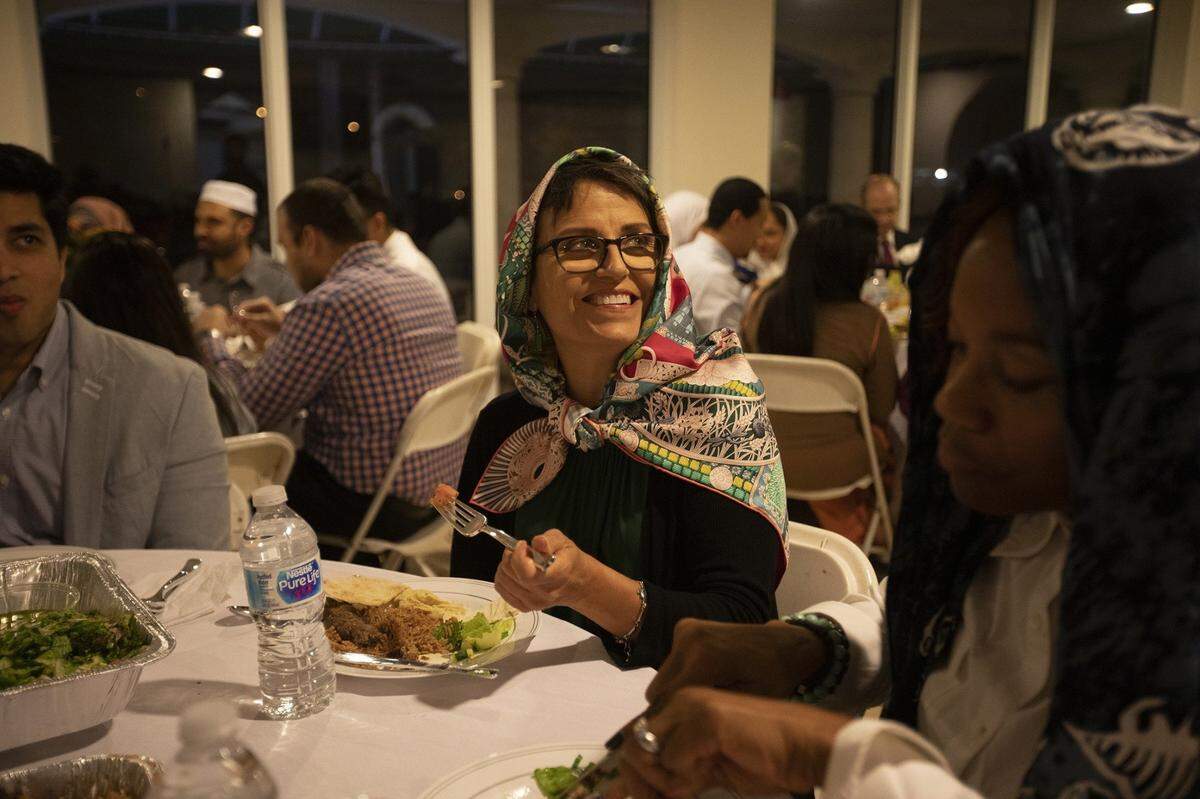 As part of Ramadan, the holy month of fasting in the Islamic religion, mosques and Islamic schools host open houses so that non-Muslims could learn more about the Islamic faith. Here Francie Peake joins an Iftar dinner at the Islamic Center of Greater Miami in 2019.