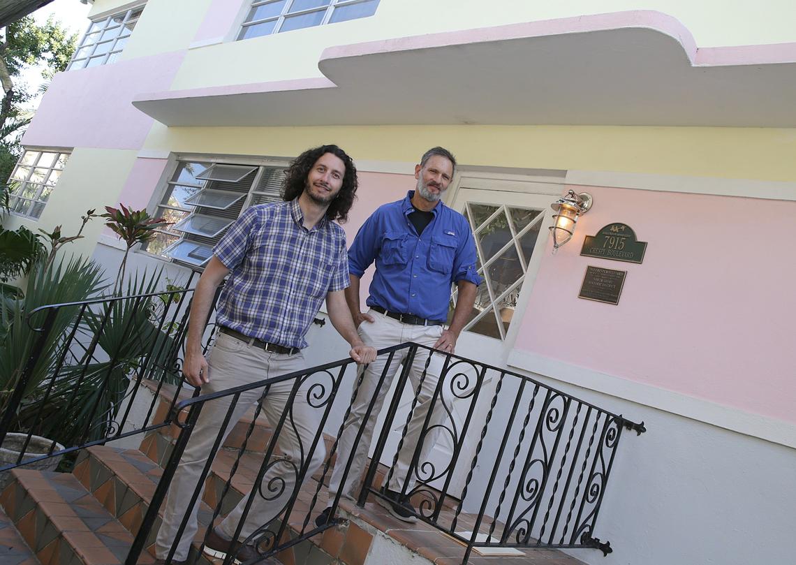 Daniel Ciraldo, left, director of the Miami Design Preservation League, and Kirk Paskal, a property owner and activist in Miami Beach’s North Beach section, stand at the entry of a Art Deco apartment building Paskal owns on the Tatum Waterway.