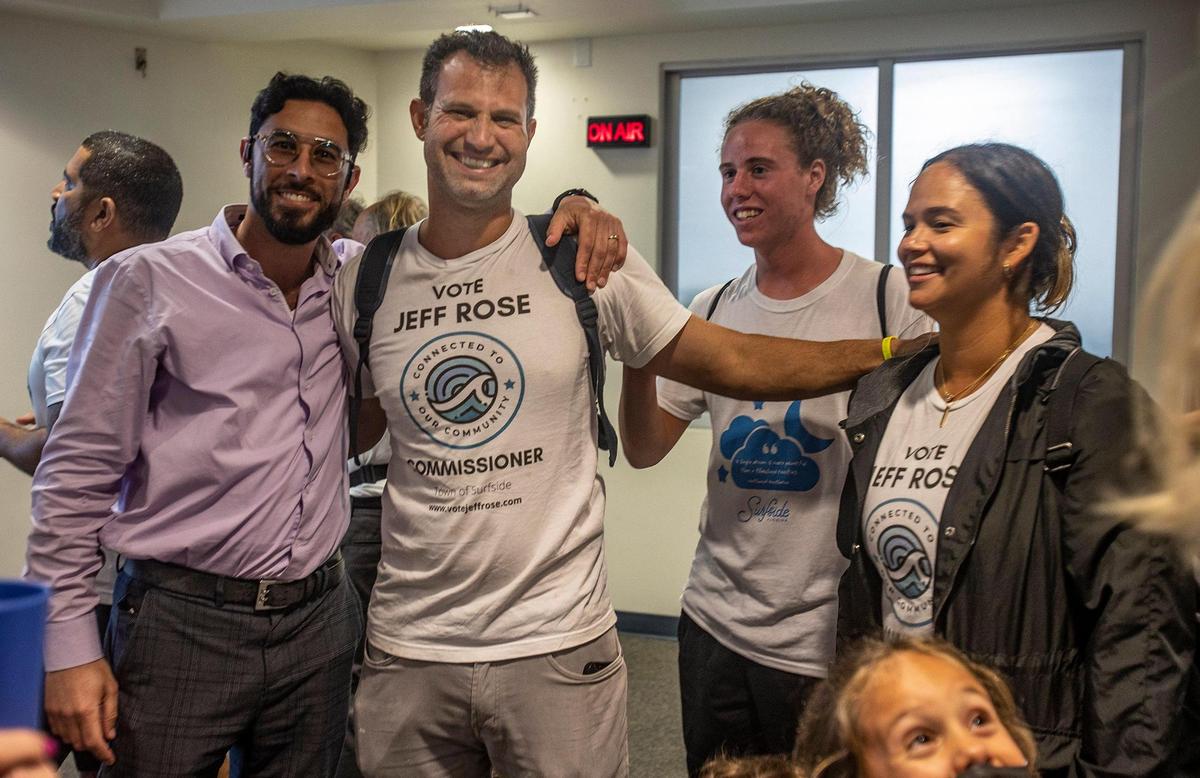Surfside Vice Mayor-elect Jeffrey Rose (center) celebrates with supporters at Town Hall on Tuesday March 15, 2022.