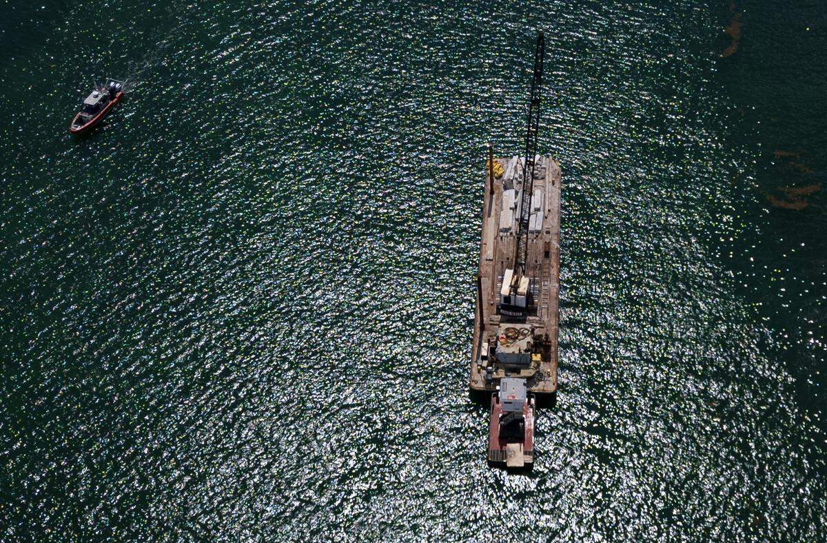 View of a barge that hit a sailboat that sank off Miami Beach’s Hibiscus Island in Biscayne Bay Monday morning, July 28, 2025. Five children and a camp counselor were aboard the sailboat, part of a Miami Yacht Club summer camp. Three girls died in the aftermath of the collision.