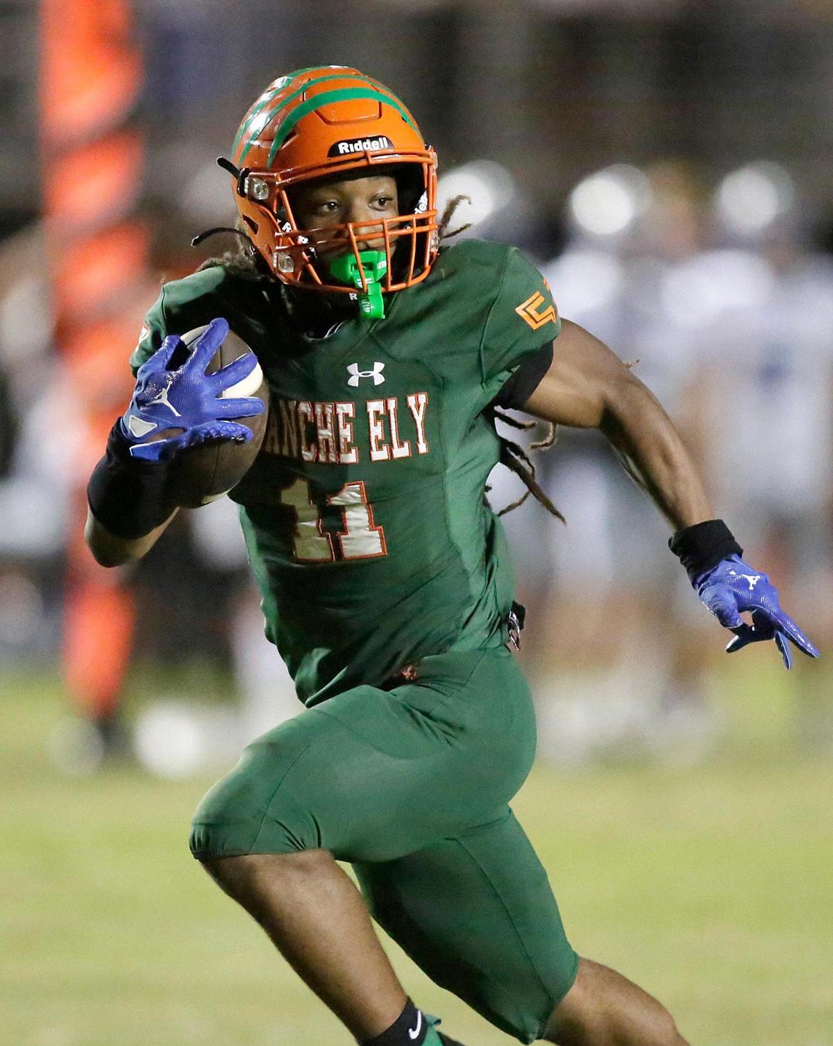 Blanche Ely Tigers running back Cedric Ward (11) carries the ball against Fort Lauderdale Flying L’s during football game on Friday, September 30, 2022 at Blanche Ely HS in Pompano Beach. Andrew Uloza / for Miami Herald