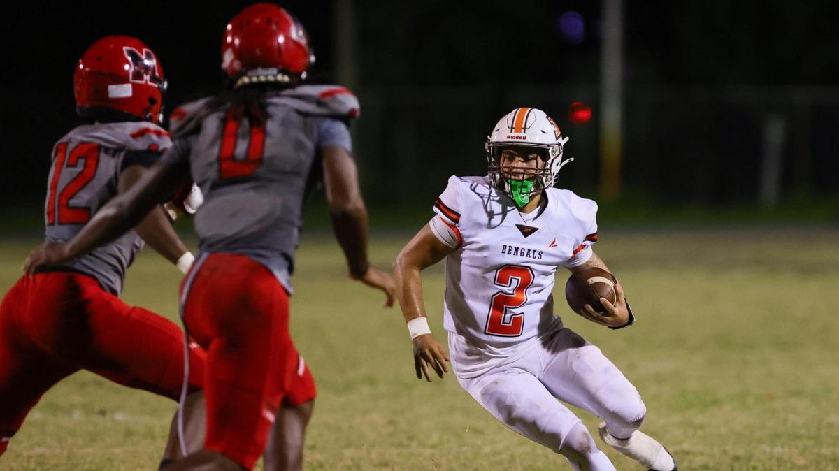 Piper Bengals quarterback Cristian Mata (2) runs with the football against the Monarch Knights during the second quarter of a high school football game at Don Conkel Stadium at Coconut Creek High School in Coconut Creek, Florida, Thursday, October 24, 2024.