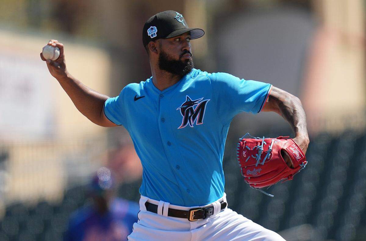 Mar 1, 2023; Jupiter, Florida, USA; Miami Marlins starting pitcher Sandy Alcantara (22) pitches against the New York Mets in the second inning at Roger Dean Stadium. Mandatory Credit: Jim Rassol-USA TODAY Sports