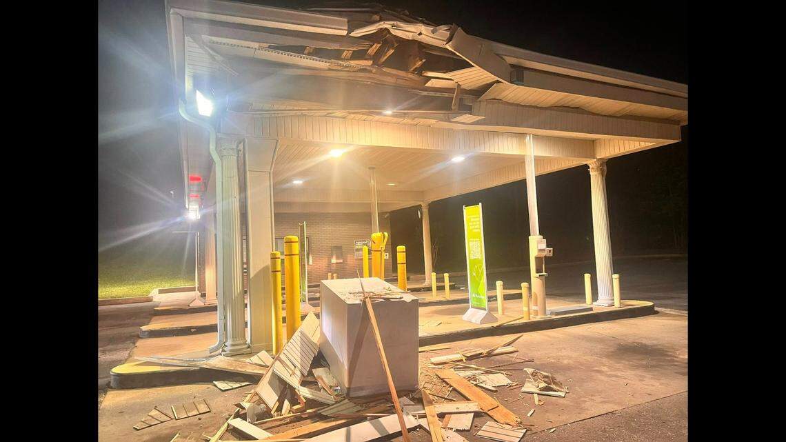 The Regions Bank ATM was found overturned at the drive-thru and the excavator was nearby, police photos show.