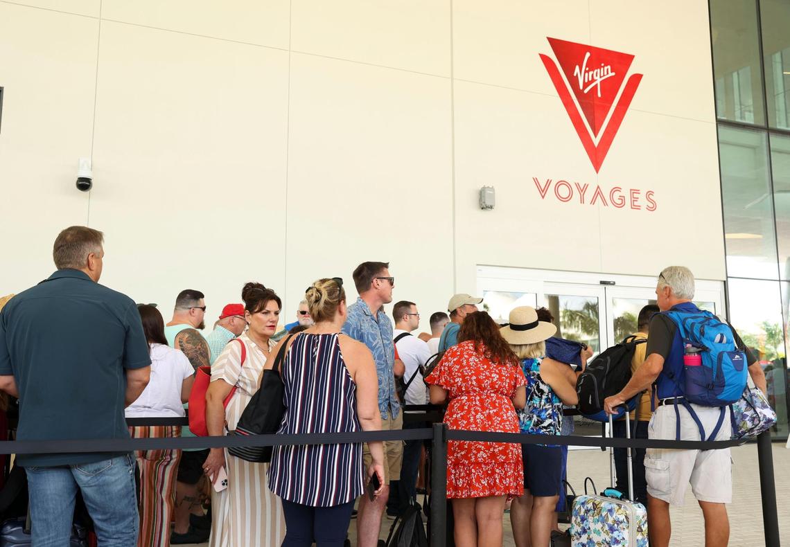 Passengers line up on Sunday, Oct. 30, 2022 to board the Virgin Voyages’ Valiant Lady ship for its first voyage from Miami to kick off the winter season.