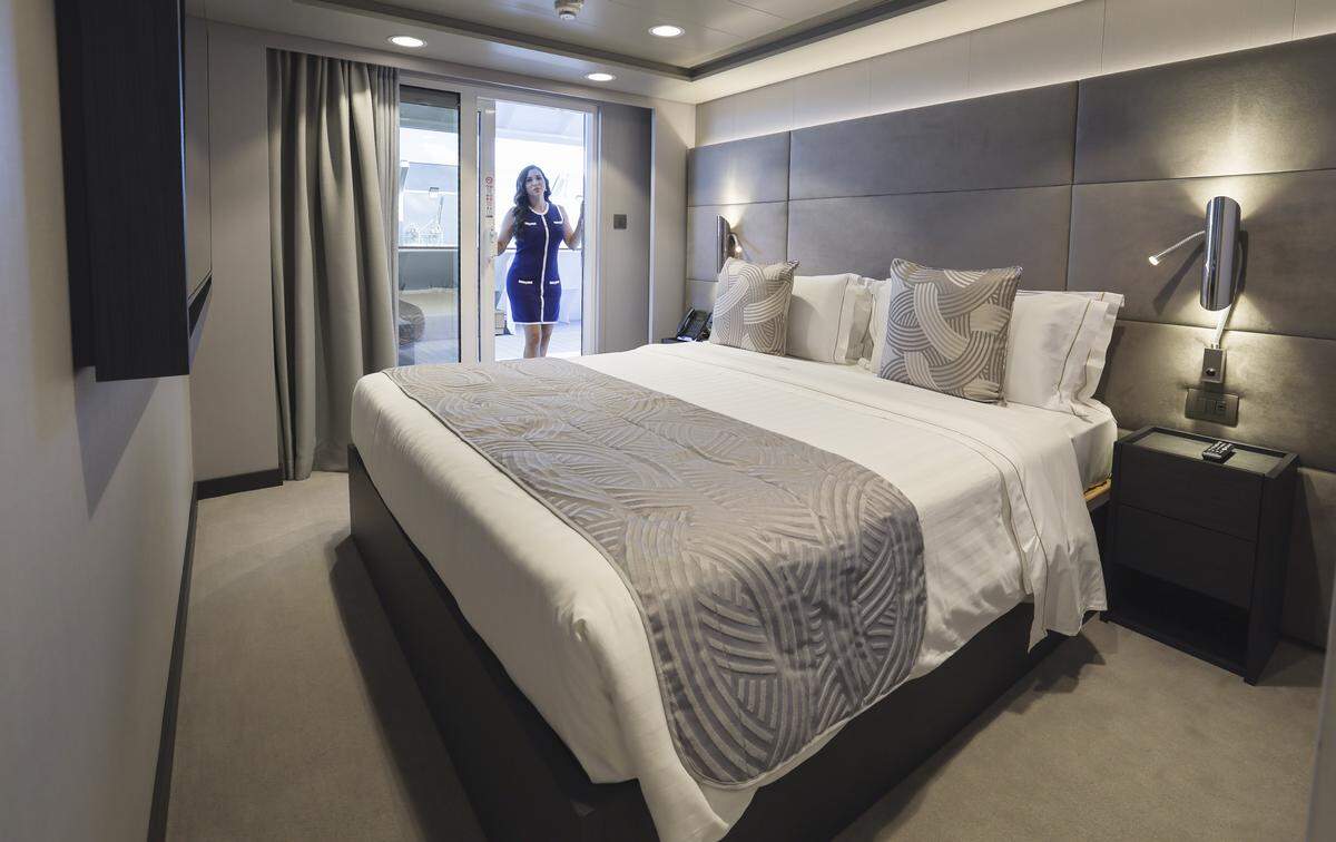 The master bedroom inside the Royal Suite in the MSC Yacht Club on MSC Poesia docked at PortMiami in Miami, Florida, on Wednesday, April 22, 2026. Built in 2008, it underwent refurbishment this year. This winter, it will be based at PortMiami heading on trips to the Caribbean.