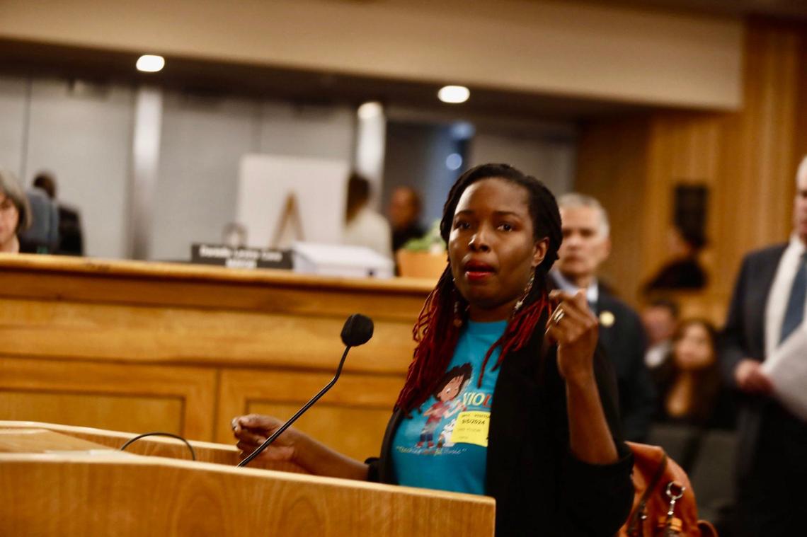 Portia Dunkley, CEO and founder two local arts groups, Teeny Violini and New Canon Chamber Collective, talks during the Miami-Dade County budget hearing to advocate against the cut of funds for the Cultural Affairs Department’s grant program on Sept. 5, 2024.