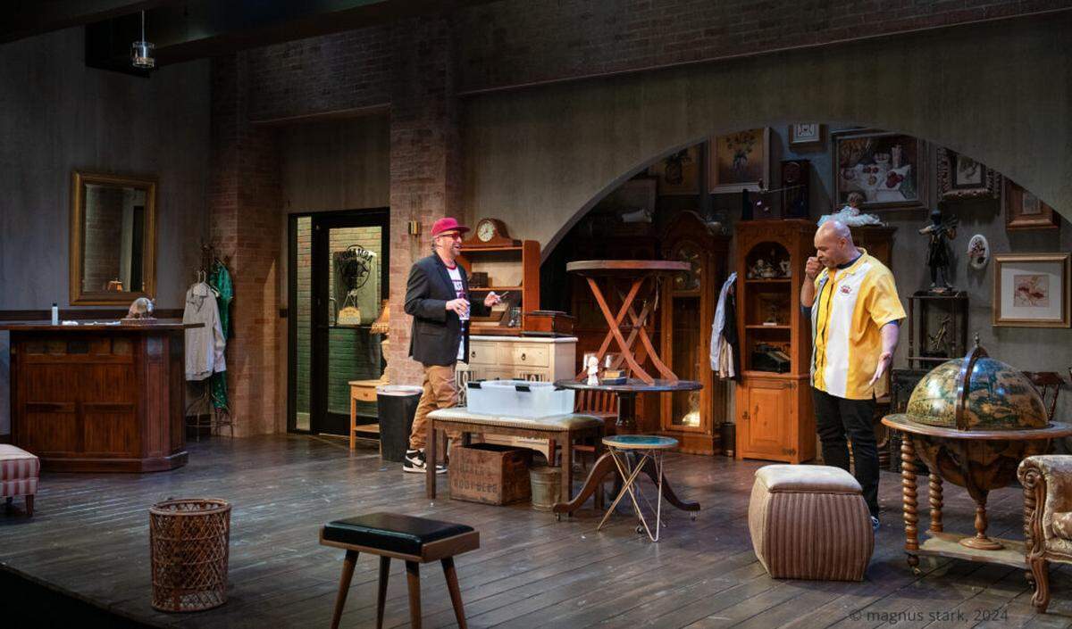 In Act Two of “King James” Matt (Gregg Weiner) and Shawn (Melvin Huffnagle) inside the bric-a-brac shop in Armand’s.