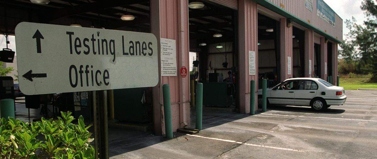 A car enters the emission inspection station at 7248 SW 42nd Ter.