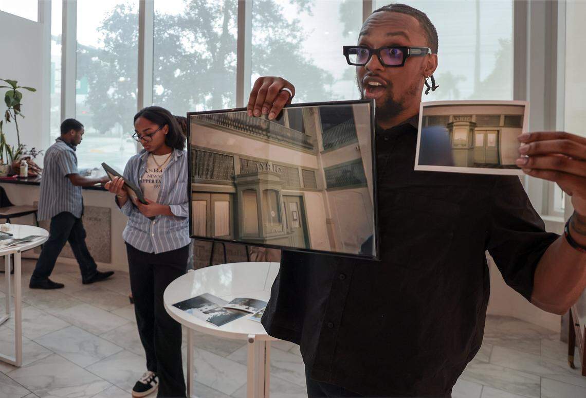 Curatorial director Nyya Toussaint holds two similar images captured by two different photographers as he and curators - Alford Archer, 15, left, and Cade Hardy, 16, center, frame and install artworks. Four high school students installed photos inside the First Church Miami coffee shop for the exhibition Sparrow, featuring the photography of local photographers navigating homelessness under the artistic direction of Miami-based artist Christopher Mitchell on Sunday, November 30, 2025.