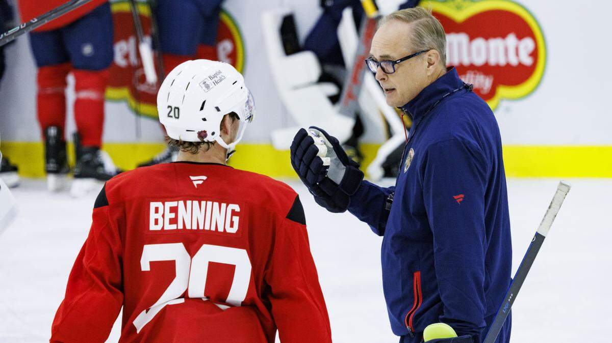 Head Coach Paul Maurice talks to defenseman Michael Benning (20) during the first practice of Florida Panthers training camp on Thursday, Sept. 18, 2025, at Baptist Health IcePlex in Fort Lauderdale, Fla. 