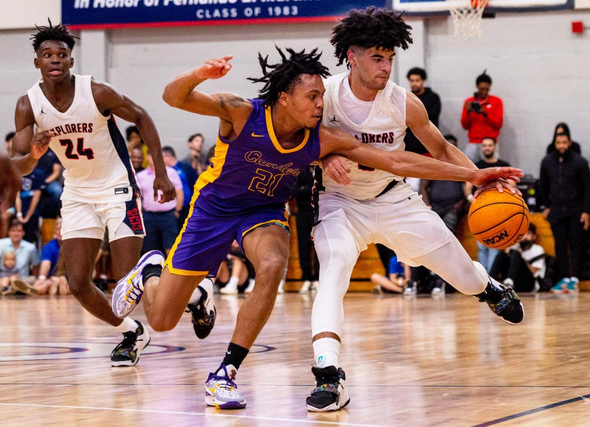 Explorers guard Cayden Boozer (2) drives on Camden guard DJ Wagner (21) during the fourth period of a high school basketball game at Christopher Columbus High School in Miami, Florida, on Wednesday, January 4, 2023.