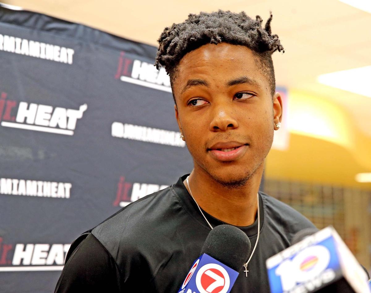 Heat rookie KZ Okpala talks to the media during his visit to Jr. Heat Basketball Camp at South Broward High School, July 24, 2019.