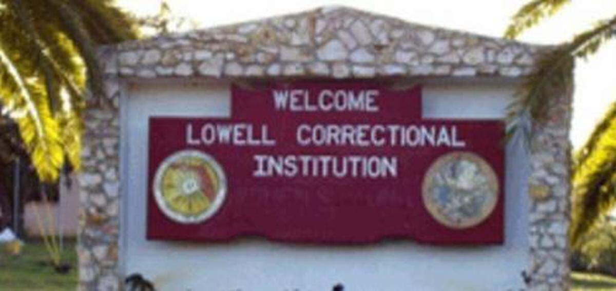 A sign welcomes inmates to Lowell Correctional Institution in Ocala, Fla.