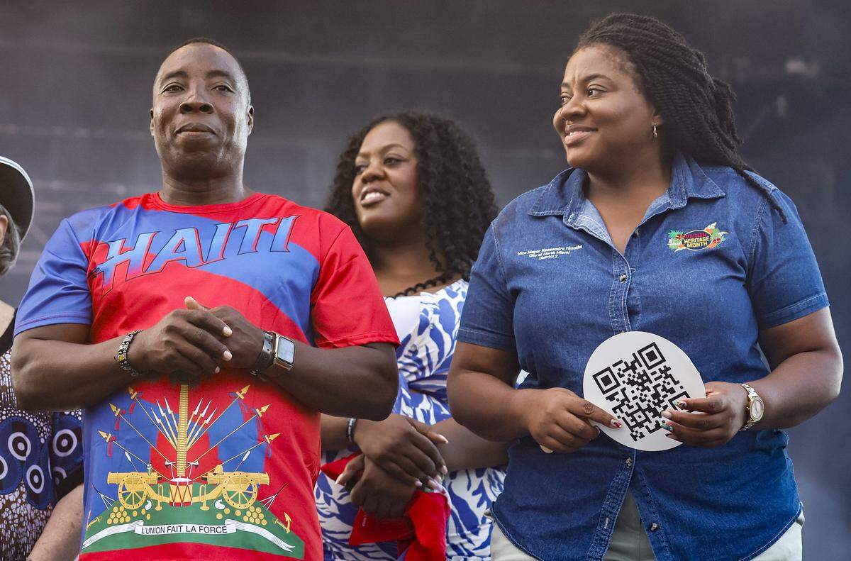North Miami Councilman Pierre Frantz Charles, North Miami Beach Commissioner Daniela Jean and City of North Miami Vice Mayor Kassandra Timothe, left to right, on stage during the 28th Annual Haitian Compas Festival at The NoMI Village celebrating Haitian Flag Day, in North Miami, Florida  on Saturday, May 16, 2026.