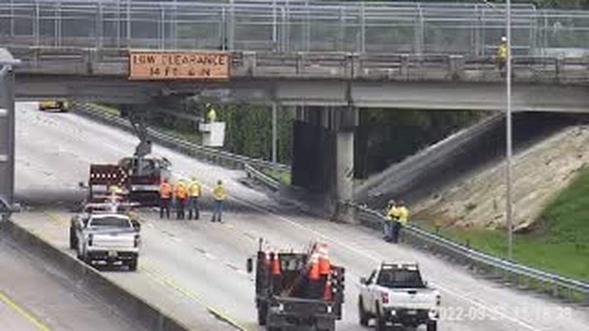 Workers try to repair the Sheridan Street overpass on the northbound side of the Florida Turnpike.