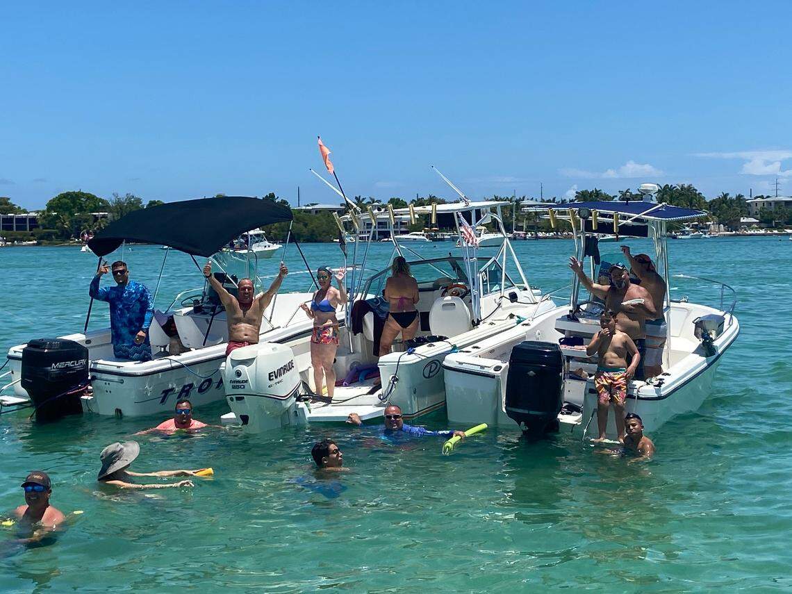Boaters party and swim while anchored in the Florida Bay behind Key Largo Sunday, May 30, 2021.