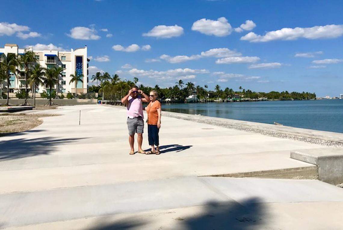 Neighbors Geoffrey Bash and Elizabeth Kristin on the waterfront strip at Pallot Park.