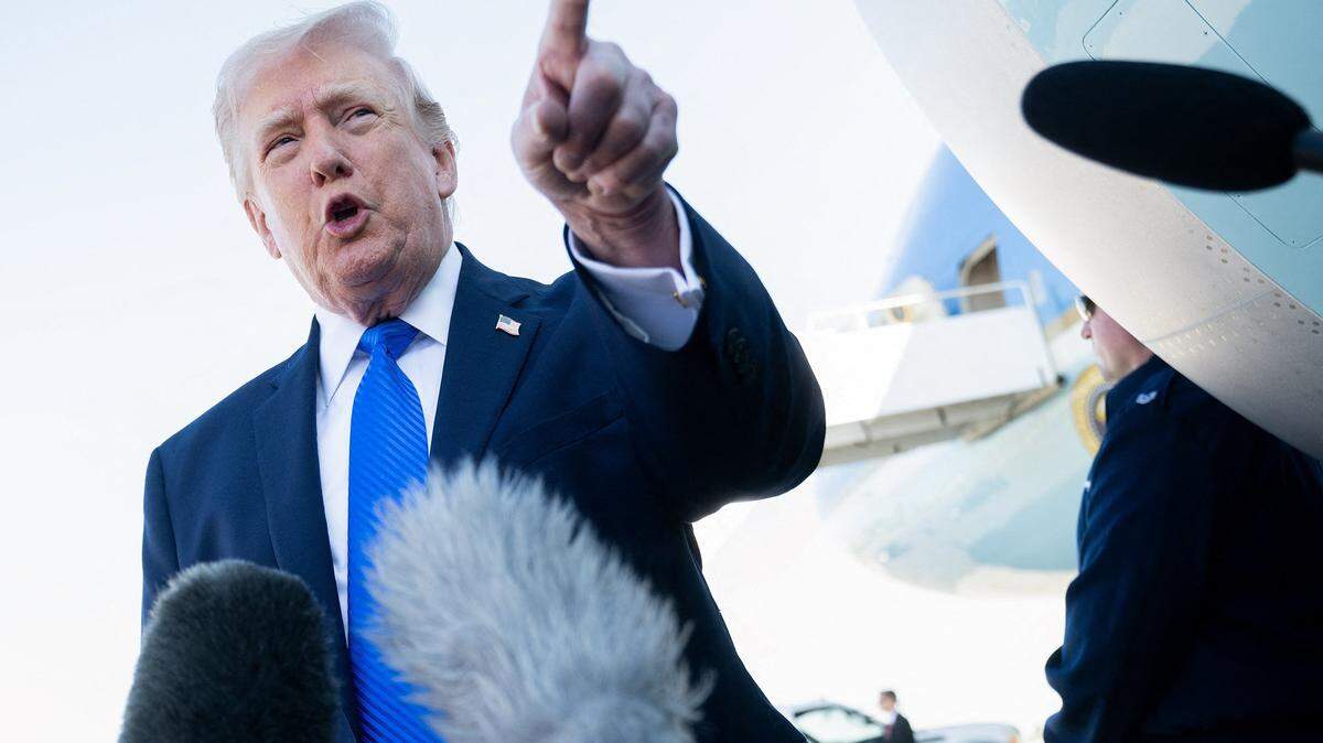 President Donald Trump speaks to reporters before boarding Air Force One in West Palm Beach on March 23, 2026.