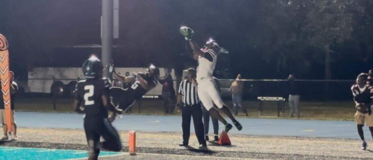 Miami Norland’s Kevin Dopson brings down a touchdown pass for the Vikings in the first quarter of their Region 4-4A semifinal playoff game against Archbishop McCarthy at the Mavericks home field on Friday.