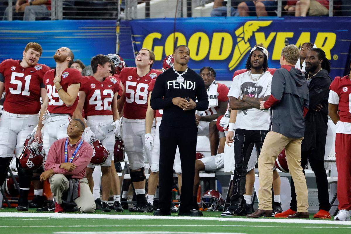 Dallas Cowboys’ Amari Cooper watches from the Alabama sideline during the first half of the Cotton Bowl NCAA College Football Playoff semifinal game against Cincinnati, Friday, Dec. 31, 2021, in Arlington, Texas.