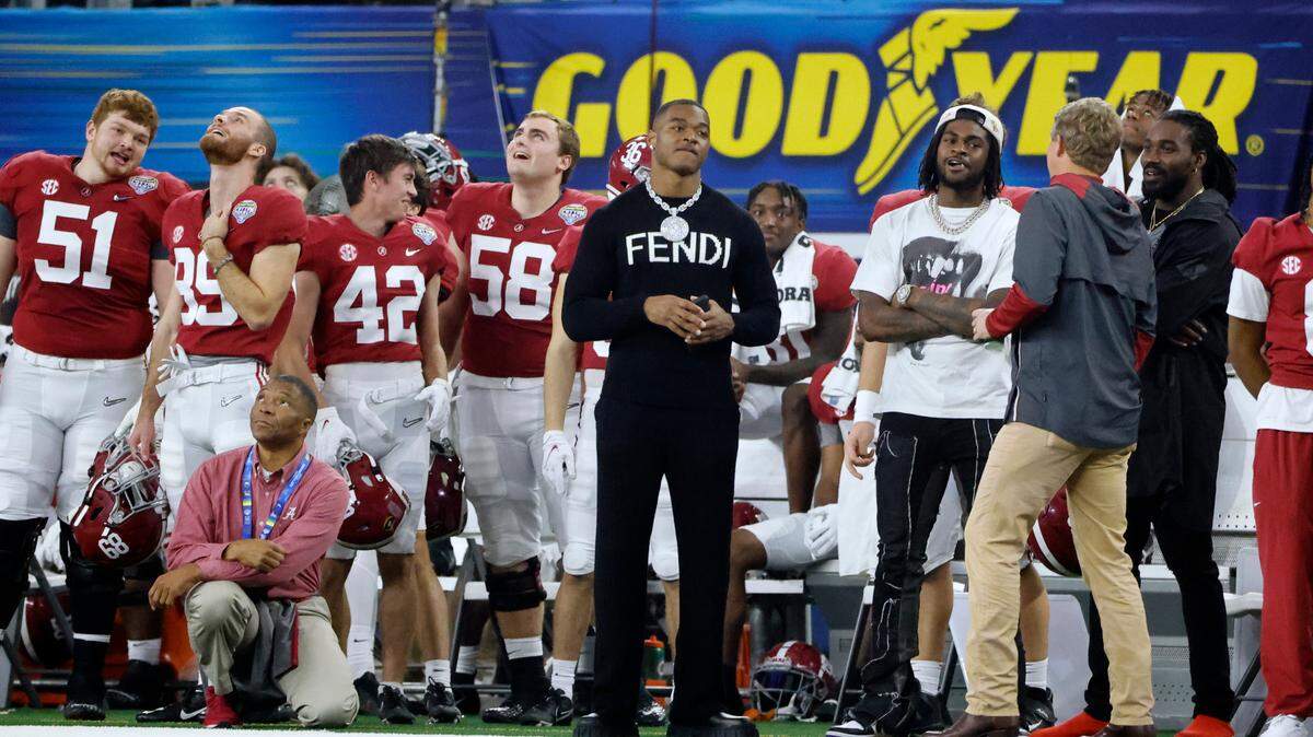Dallas Cowboys’ Amari Cooper watches from the Alabama sideline during the first half of the Cotton Bowl NCAA College Football Playoff semifinal game against Cincinnati, Friday, Dec. 31, 2021, in Arlington, Texas.