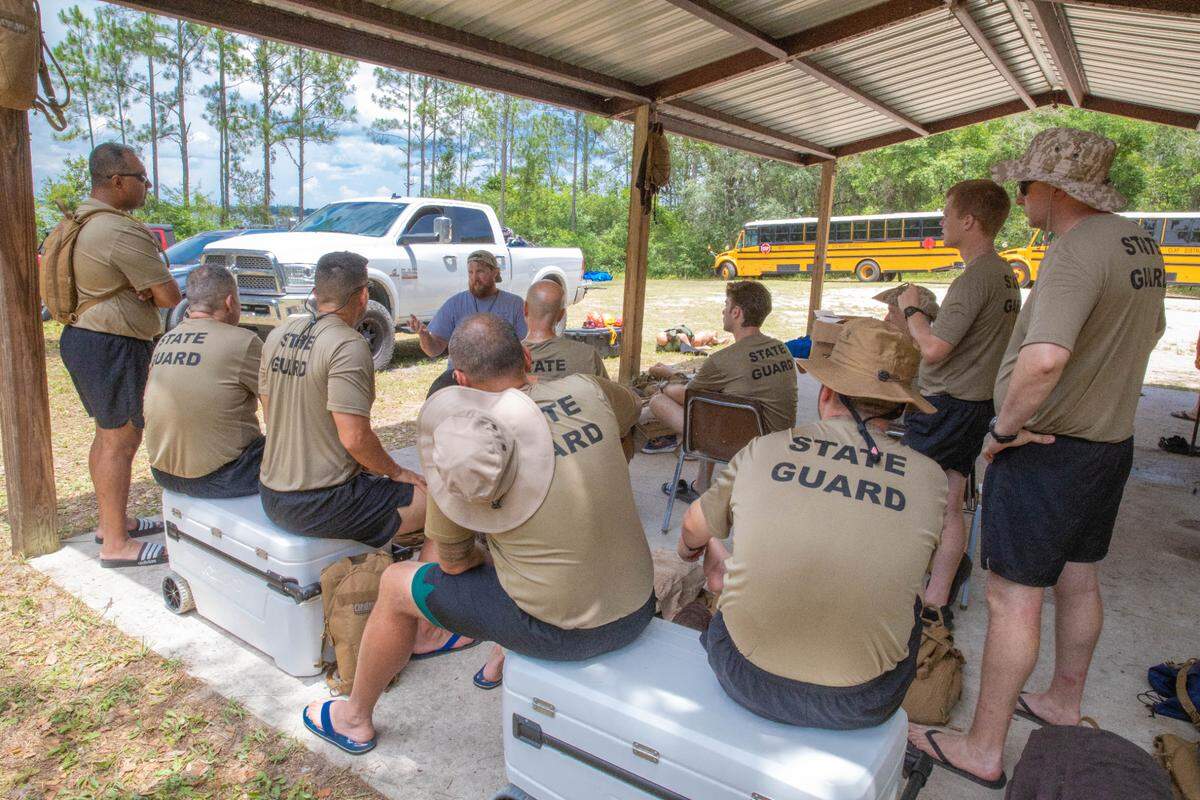 Florida State Guard recruits receive aquatic skills instruction from Florida National Guard soldiers and civilian contractors to execute a water survival training exercise at Camp Blanding, Florida, June 14, 2023. Soldiers with the 53rd Infantry Brigade Combat Team, 83rd Troop Command, and 50th Regional Support Group supplemented the multi-day training that included rescue swimming, entering and exiting water vehicles, water survival techniques and water vehicle maneuvering.