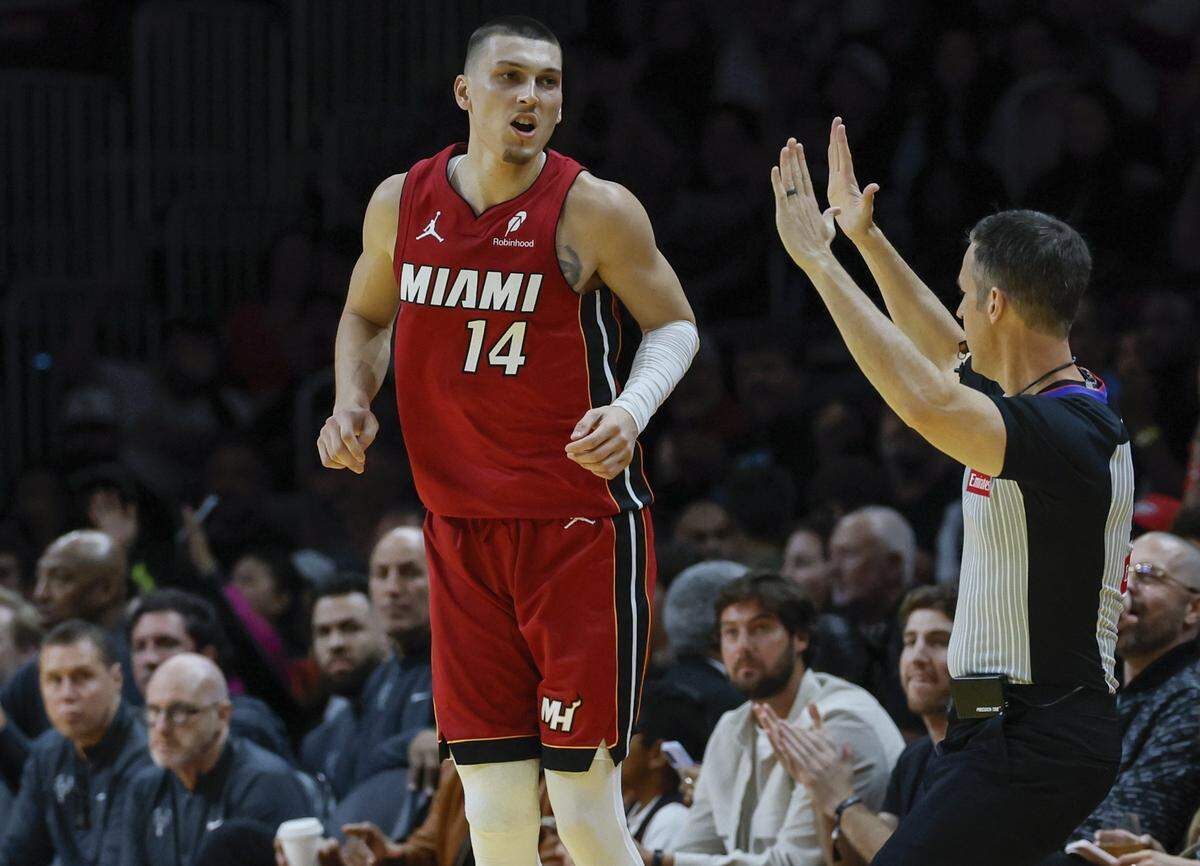 Miami Heat guard Tyler Herro (14) reacts after sinking a three pointer in the first half against the Milwaukee Bucks during their NBA basketball game at Kaseya Center in Miami on November 26, 2025.
