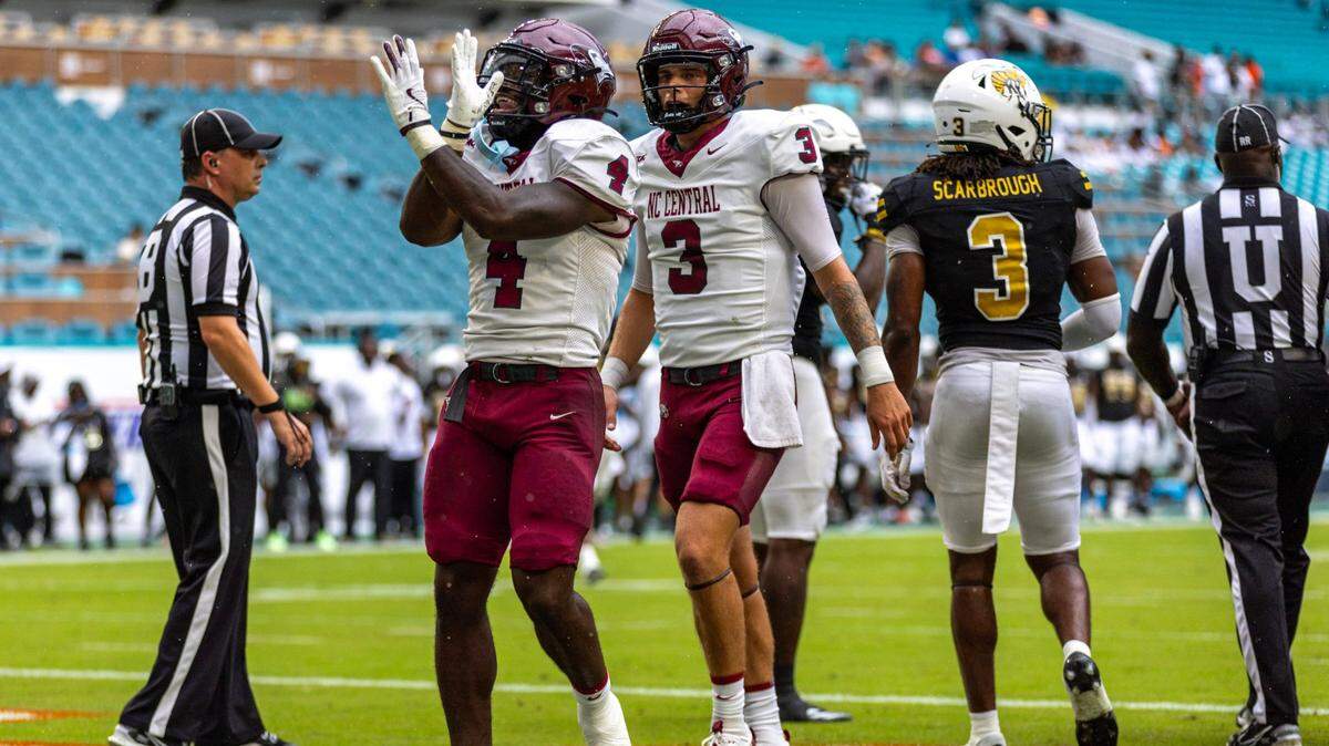 North Carolina Central Eagles running back J’Mari Taylor (4) reacts to scoring a touchdown as quarterback Walker Harris (3) looks on during the first half of the Orange Blossom Classic at Hard Rock Stadium on Sunday, September 1, 2024, in Miami Gardens, Fla.