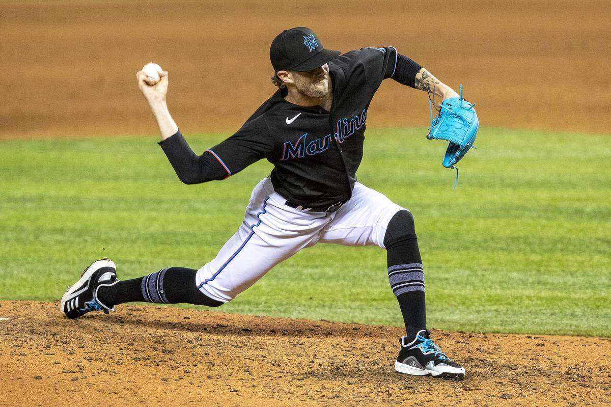 Miami Marlins Adam Cimber(90) pitches during the ninth inning of an MLB game against the Milwaukee Brewers at loanDepot park in the Little Havana neighborhood of Miami, Florida, on Friday, May 7, 2021.