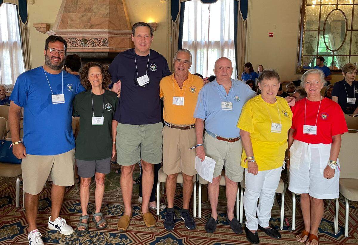 From left, Jose Ruiz, Emilia Qualich, Andres Mendoza, Jose Maria Arellano, Jose Valdes-Fauli, Millie Houck and Gloria Mendoza pose for a picture at The Biltmore Hotel during a family reunion this weekend. The different colored shirts represent each of the family’s seven groups.