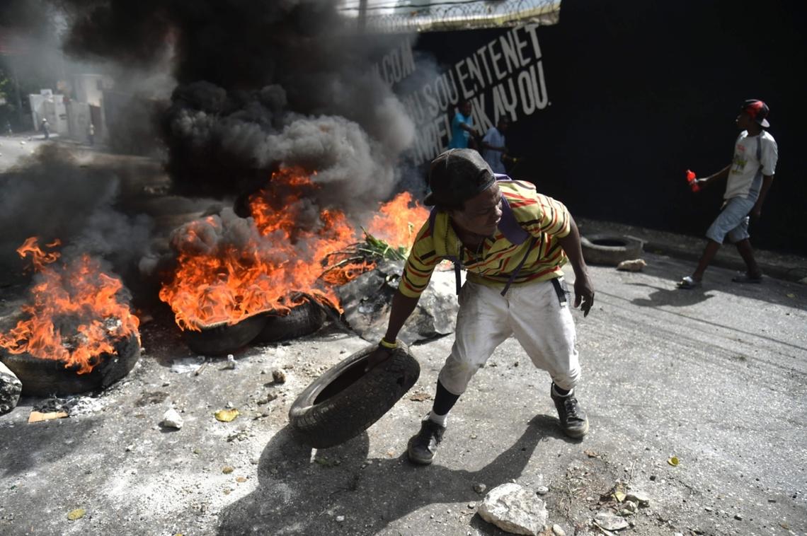 Protesters barricade a street in the Port-au-Prince suburb of Petion-Ville on July 7, 2018, to protest against the increase in fuel prices.Haiti's Prime Minister, Jack Guy Lafontant, on Saturday called for patience from residents of the Caribbean nation amid deadly protests over an unpopular fuel price rise. At least one person has died there in the past day. The capital has stood paralyzed since July 6, following the government announcement that gasoline prices would rise by 38 percent, diesel by 47 percent and kerosene by 51 percent starting this weekend.