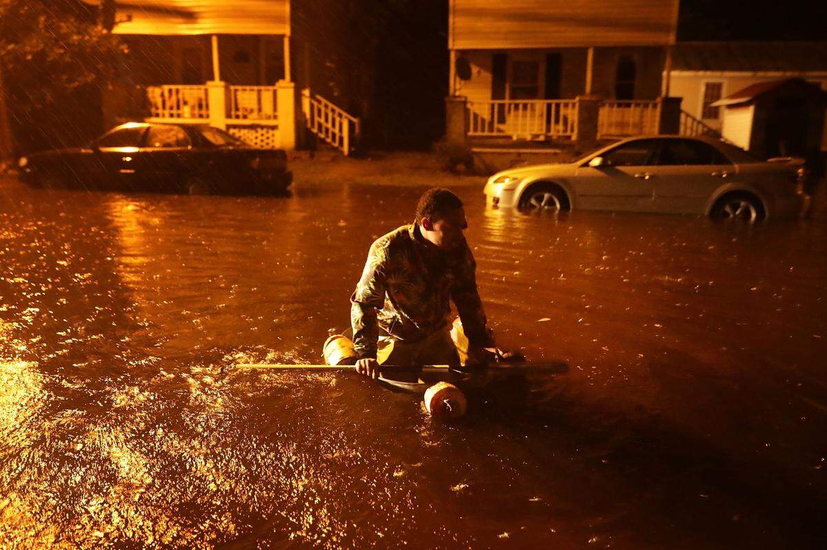 Michael Nelson floats in a boat made from a metal tub and fishing floats after the Neuse River topped its banks and flooded parts of the small town of New Bern, North Carolina. Newly elected Mayor Sabrina Bengel said about 4,300 homes were damaged, affecting about a third of the town’s population.