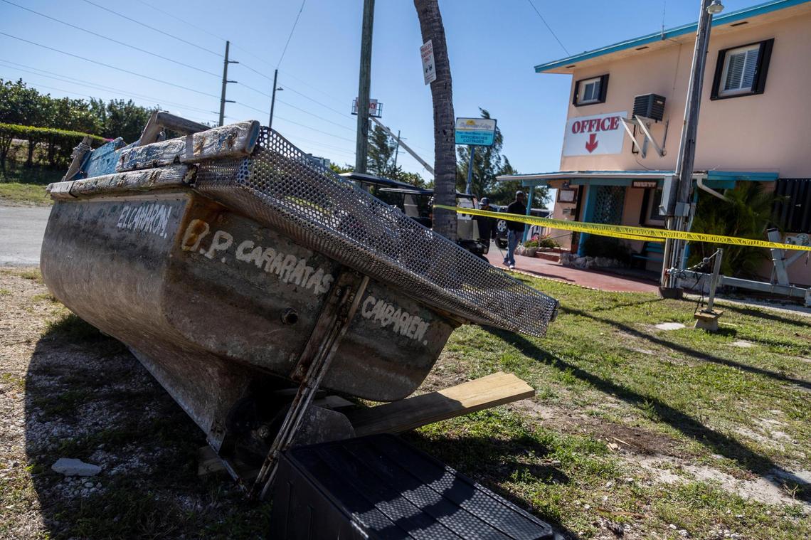 A migrants’ boat named ‘El Camaron’ and hailing from Caibarien, Cuba, sits in front of the Edgewater Lodge in Layton, mile marker 65, in the Florida Keys on Jan. 8, 2023. Some of the vessels used by Cuban migrants to reach the United States wind up being used as front lawn decorations by residents and businesses of the Florida Keys.