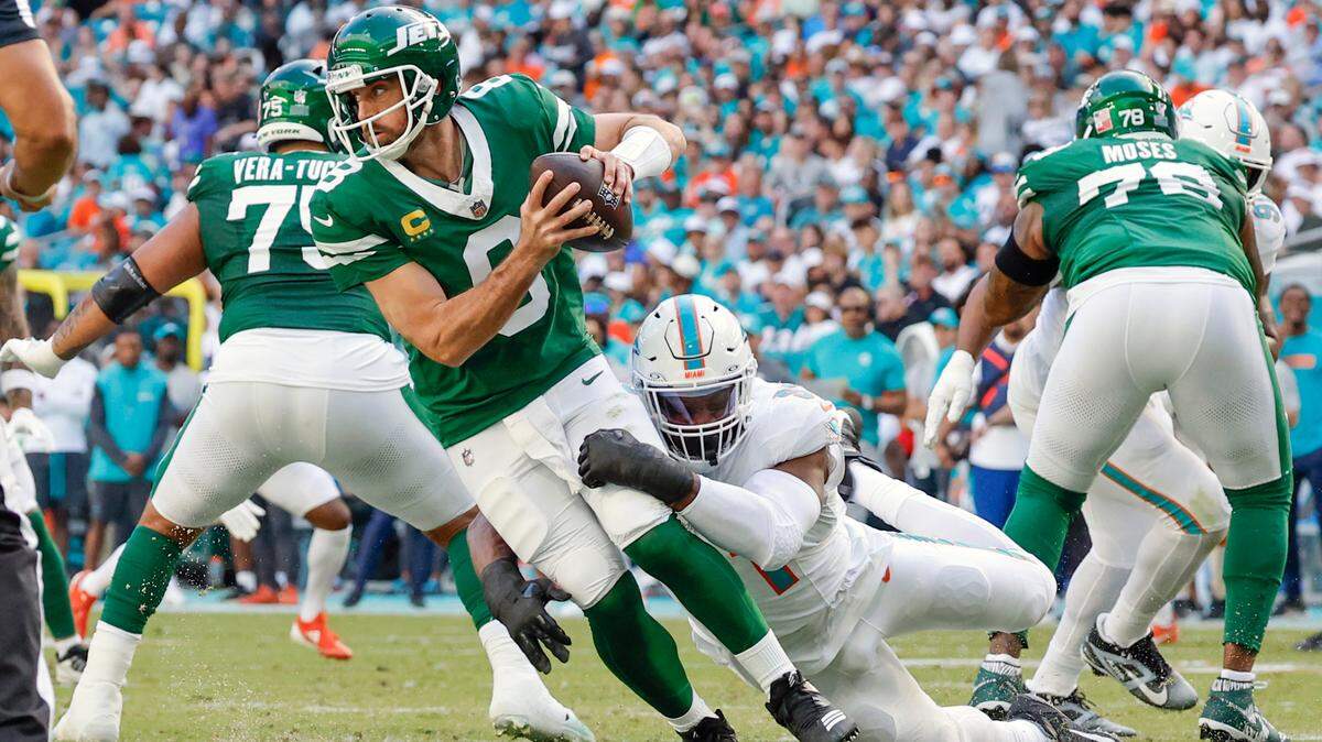 Miami Dolphins linebacker Emmanuel Ogbah (91) sacks New York Jets quarterback Aaron Rodgers (8) in the first half of their NFL football game at the Hard Rock Stadium in Miami Gardens, Florida on Sunday, December 8, 2024.