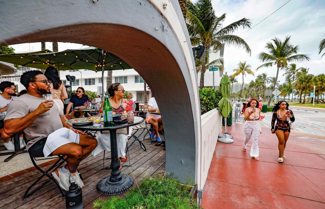 Matthew Green and his mother Yvonne Hosang have lunch at Café Americano Ocean along Ocean Drive during spring break on Miami Beach, Florida on Saturday, March 15, 2025.
